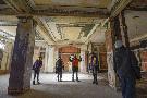 Owner developer Meir Dick (centre) describes the architectural details of the main entrance. - Gary Yokoyama,The Hamilton Spectator